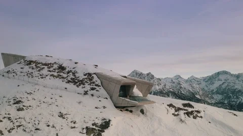 Aerial orbit and pull-away shot of a modern gallery/museum on top of a Stock Footage 123833029