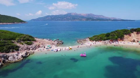 Aerial orbit around the beach of Ksamil twin islands in Albania Stock Footage 342001933