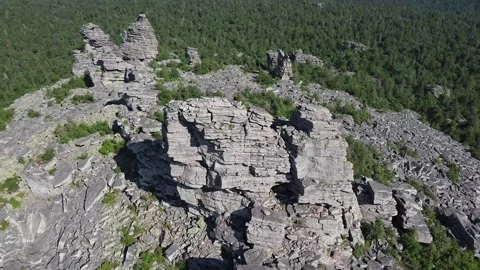 Aerial Orbit Around Columnar Stone Pillars and Taiga Video stock 312925042