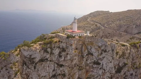 Aerial - Orbit around lighthouse on cliffs - Mallorca - Spain Video stock 96023419