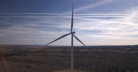 Aerial orbit around lone windmill in a wind farm Stock Footage 99547108