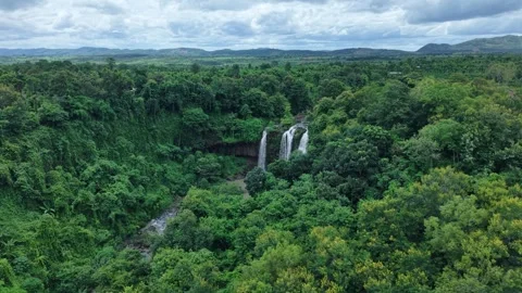 Aerial orbit around a three-stream waterfall in pristine forest Stock Footage 342209919