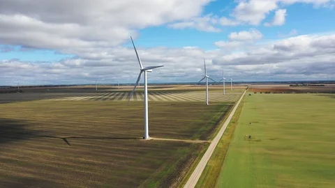 Aerial orbit around wind mill in a wind farm Stockbeeldmateriaal 101000697