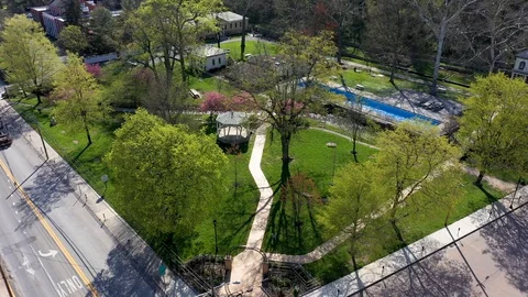 Aerial orbit camera moving to the left looking down onto Berkeley Springs State Stock Footage 128842026