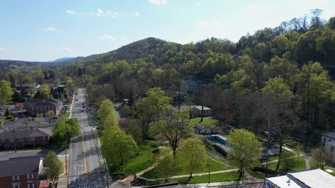 Aerial orbit camera moving to the left showing Berkeley Springs State Park in Stock Footage 128842065