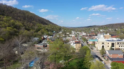 Aerial orbit camera moving to the right showing Berkeley Springs State Park in Stock Footage 128841945