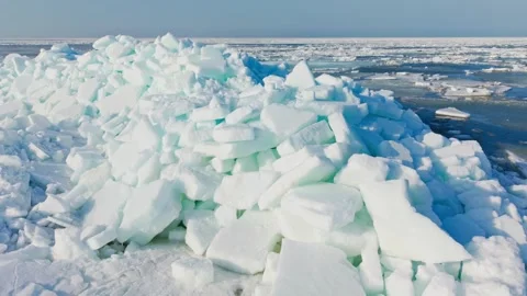 Aerial orbit captures massive coastal ice as climate risk modeling reference Stock Footage 341846018