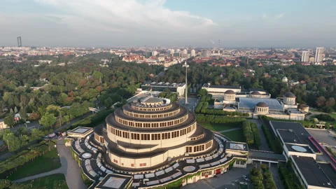 Aerial orbit of Centennial Hall in Wrocław in morning golden light Stock Footage 346658719