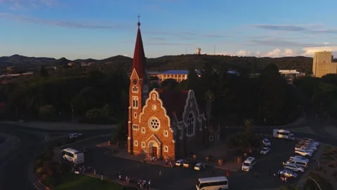 Aerial orbit of Christuskirche in Windhoek, Namibia at golden hour Stock Footage 341438554