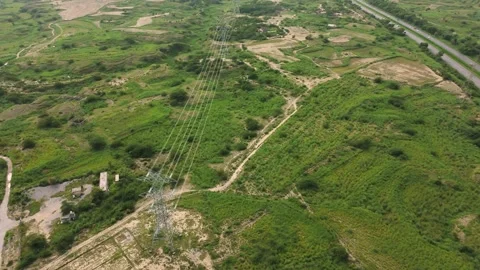 Aerial orbit clip of electrical power grid tower Stock Footage 342400063