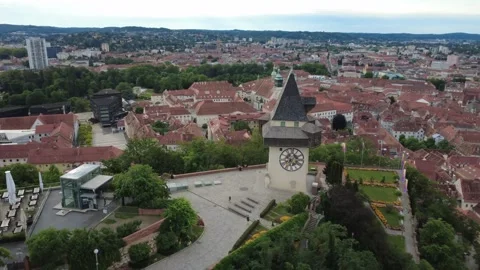 Aerial orbit of the clock tower in Graz old town, Austria at dawn Stock-Footage 338276713