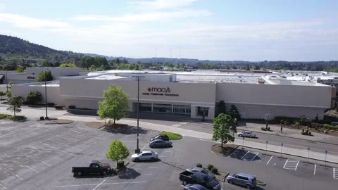 Aerial orbit of closed Macy's store and empty parking lot no people shopping. Stock-Footage 130481814