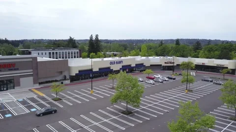 Aerial orbit of closed Old Navy store during coronavirus outbreak pandemic. Stock Footage 130482373