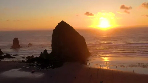 Aerial orbit drone footage of Haystack Rock in Cannon Beach, Oregon during Stock Footage 273758015