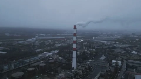 Aerial Orbit Flight Around Industrial Smokestack Over City Stock Footage 341767558