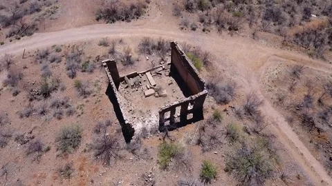 Aerial orbit of ghost town ruins in Cortland, AZ Stock Footage 73967563