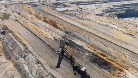Aerial orbit giant spreader operating in open-pit lignite mine in Germany Stock Footage 332477012