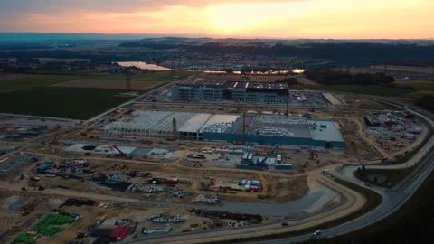 Aerial orbit of the Google data center construction site in Kronstorf at sunrise Stock Footage 342179194