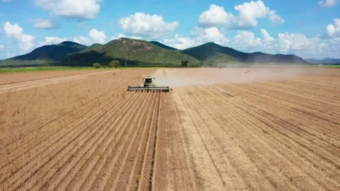 Aerial orbit of harvester Stock Footage