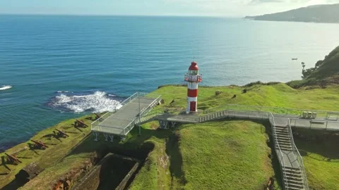 Aerial orbit isolated from the red lighthouse at Niebla Castle on a sunny day Stockbeeldmateriaal 336639201