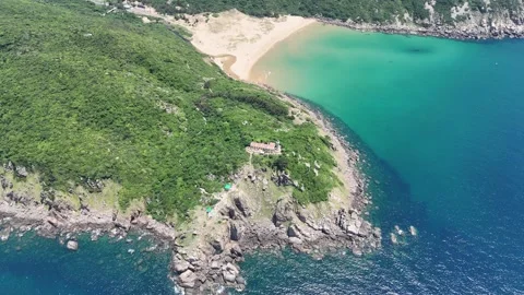 Aerial orbit of Mui Dien Lighthouse and Bai Mon Beach, Phu Yen, Vietnam Stock Footage 339406209