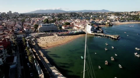 Aerial orbit over flag at Cascais Bay ahead of Pope Francis's visit to Cascais Stock Footage 247022191