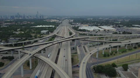 Aerial Orbit Over Highway Interchange Reveals Austin Skyline on Overcast Evening Video stock 330332292