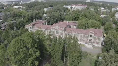 Aerial orbit over historic building in green area Video stock 332600533