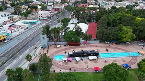 Aerial orbit over a park plaza with a vintage locomotive Stock-Footage 342062753