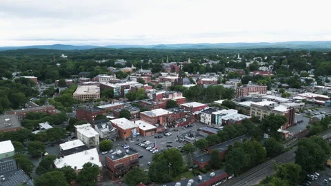 Aerial orbit pullback along train tracks to establish Northampton Stock Footage 278571260