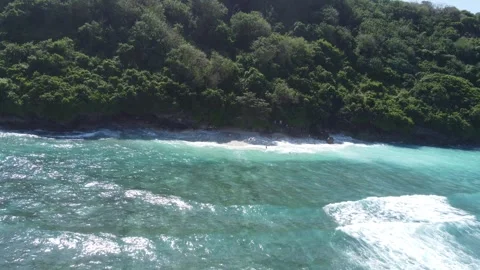 Aerial orbit right over Green Bowl Beach cliffs, Bali Stock Footage 329133353
