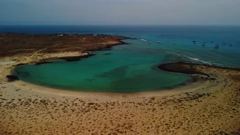 Aerial orbit of the sandy bay on Lobos island Fuerteventura Stock Footage 176900599