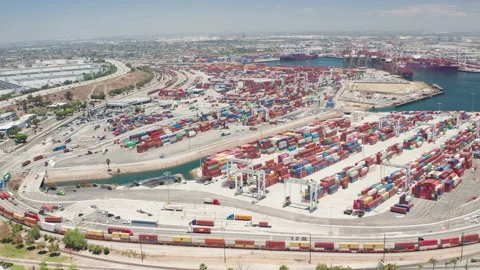 Aerial orbit shot of cargo, freight, shipping containers in Los Angeles Harbor Stock Footage 200858555