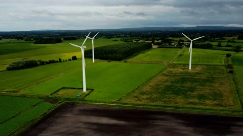 Aerial orbit of a small rural wind farm Stock Footage 176594419