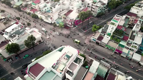 Aerial Orbit Tilt Down Over Busy Traffic Intersection In Morning Sunlight Stock Footage 343872510