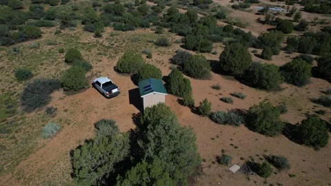 Aerial orbit of a tiny house in the Arizona desert Stock Footage 205048899