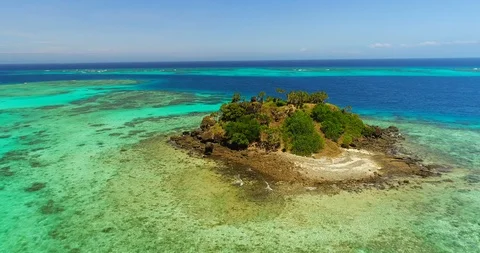 Aerial Orbit of a Tiny Rock Island in the Fiji Islands Stock Footage 98640241