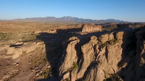 Aerial orbit of towering rock formations in the desert Stock Footage 74755638