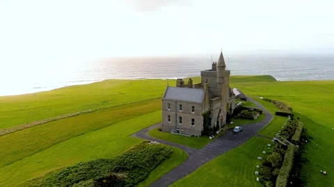 Aerial orbit view of Mullaghmore Head and Classiebawn Castle. Co Sligo, Ireland Stock Footage 285810874