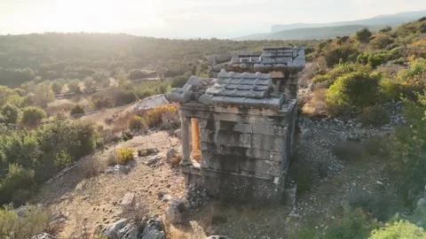 Aerial Orbit View of two Ancient Roman Stone Mausoleums in Rural Landscape near  Stock Footage 324139463