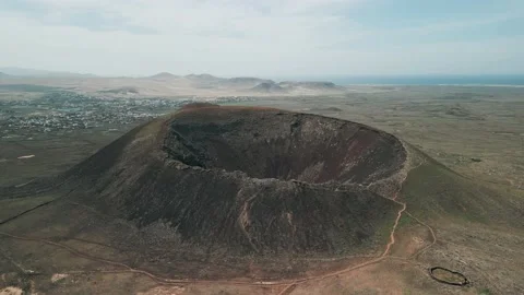 Aerial orbital clip of the dramatic Volcan Calderon Hondo volcano Stock Footage 227762190
