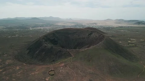 Aerial orbital clip of the dramatic Volcan Calderon Hondo volcano Stock Footage 227768433