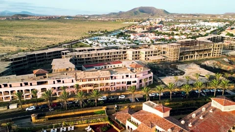 Aerial orbital view of the abandoned complex opposite Bahia Real Resort Stock Footage 223957728