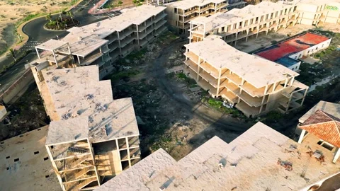 Aerial orbital view of the abandoned complex opposite Bahia Real Resort Stock Footage 223958224