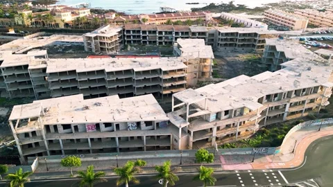 Aerial orbital view of the abandoned complex opposite Bahia Real Resort Stock Footage 223958230