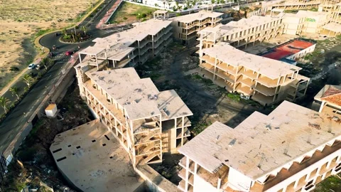 Aerial orbital view of the abandoned complex opposite Bahia Real Resort Stock Footage 223960402