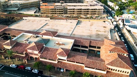 Aerial orbital view of the abandoned complex opposite Bahia Real Resort Stock Footage 224034418