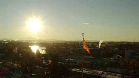 Aerial orbiting around a triangular flag on Gurdwaras building Stock Footage 171588565