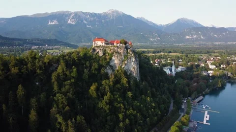 AERIAL Orbiting Shot of Bled Castle in Lake Bled. Slovenia on a Sunny Summer Day Видео 332708950
