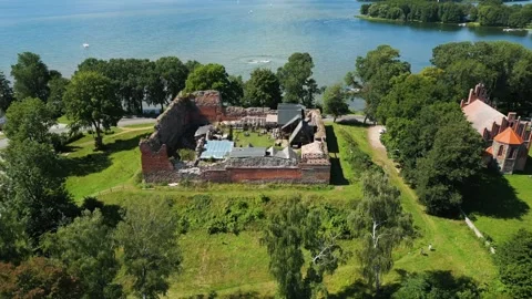 Aerial orbiting shot of the Drahim castle ruins in Poland Stock Footage 329910582